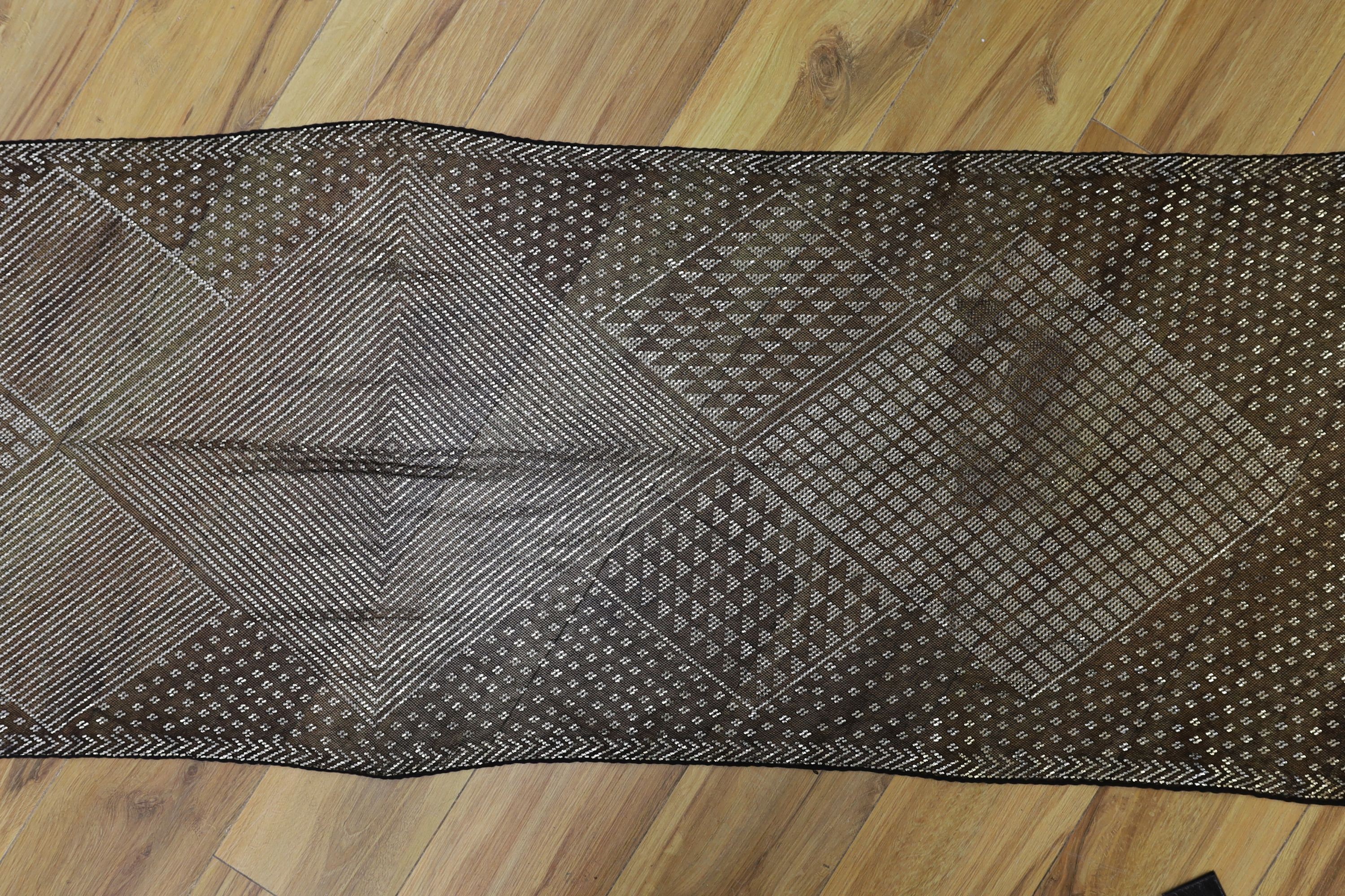 A dress made from a metal and black net Egyptian shawl; a similar shawl and a piece of shawl